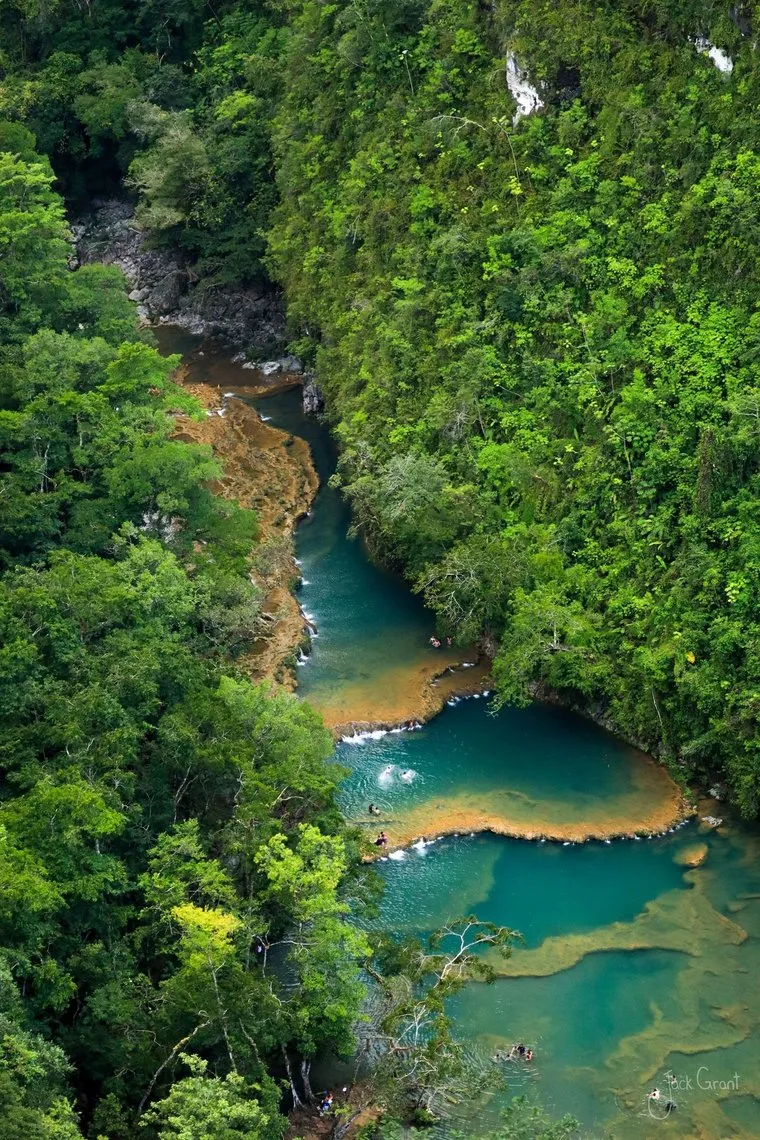 Turquoise limestone pools of Semuc Champey seen from above the jungle, Guatemala